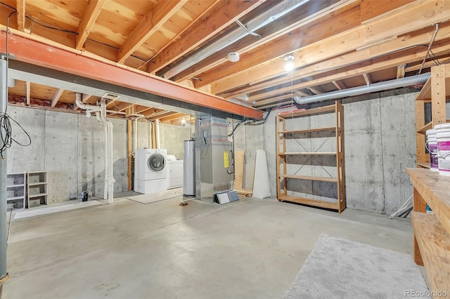 8479 Rabbitbrush Way, Parker, CO 80134 - unfinished basement featuring independent washer and dryer, heating unit, and water heater