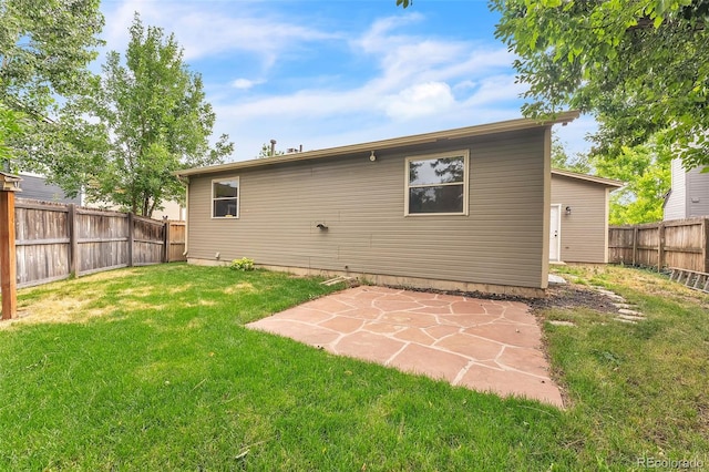 8479 Rabbitbrush Way, Parker, CO 80134 - back of house featuring a fenced backyard and a patio area