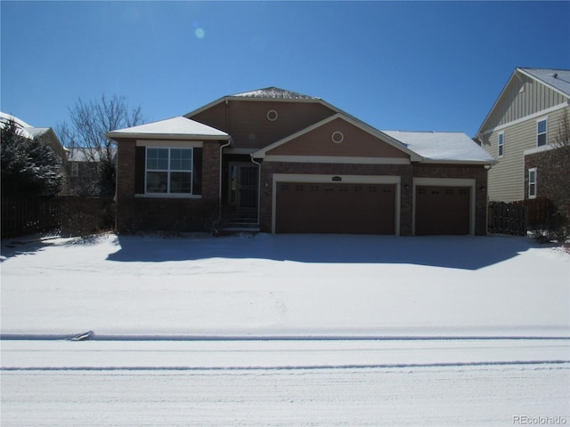 view of front of property with brick siding and an attached garage