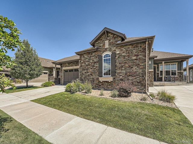 view of front facade with a garage and a front lawn