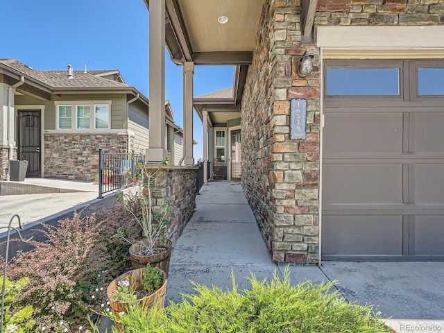 doorway to property featuring a garage