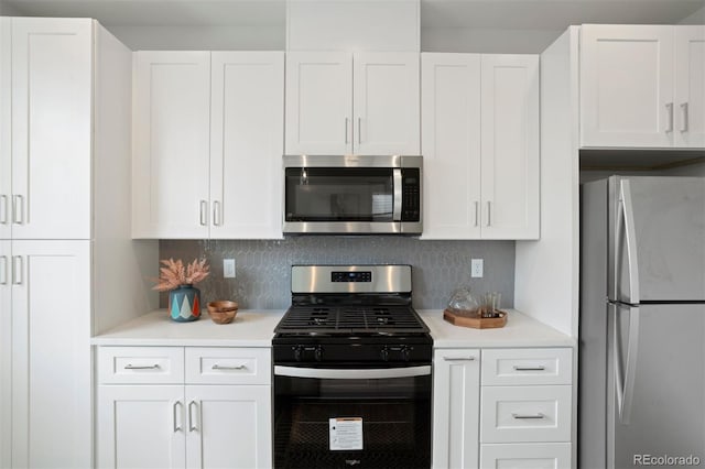 kitchen with light countertops, white cabinets, and appliances with stainless steel finishes