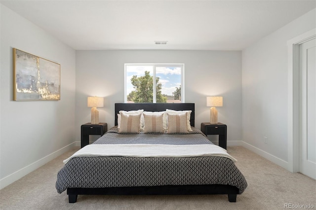 bedroom with baseboards, visible vents, and carpet floors