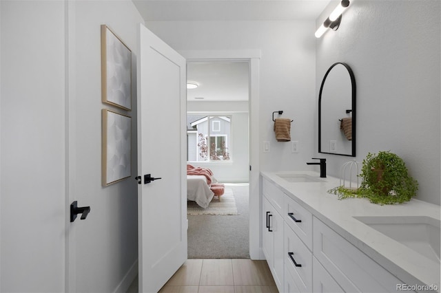 4020 Upham St, Wheat Ridge, CO 80033 - full bathroom featuring ensuite bath, double vanity, and a sink