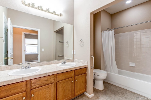 full bathroom with shower / tub combo, double vanity, a sink, and toilet