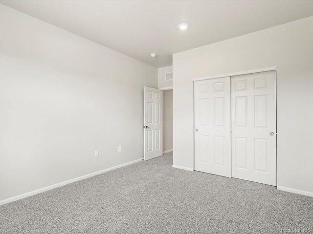 1612 Colorado River Dr, Windsor, CO 80550 - unfurnished bedroom with carpet, a closet, and recessed lighting