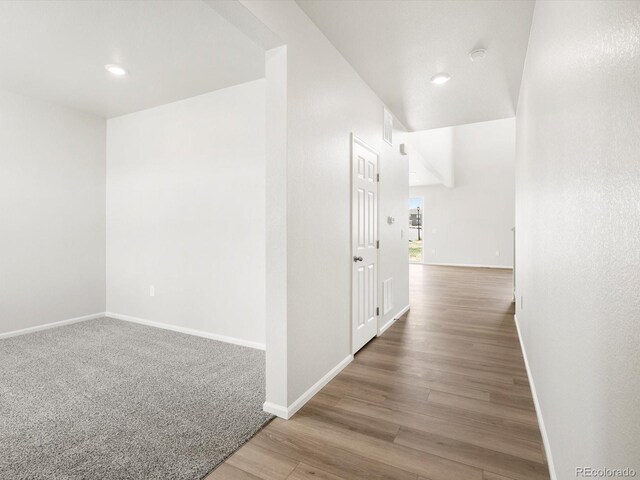 1612 Colorado River Dr, Windsor, CO 80550 - hallway with wood finished floors and recessed lighting