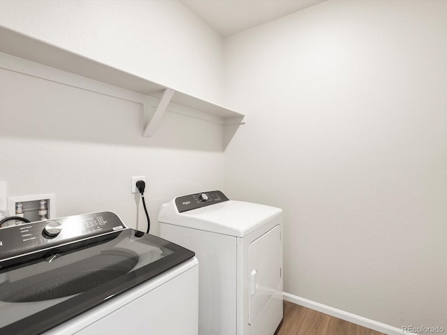 1612 Colorado River Dr, Windsor, CO 80550 - laundry area featuring light wood finished floors and washer and clothes dryer