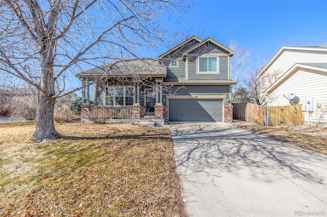 view of front of home with driveway, an attached garage, covered porch, fence, and brick siding