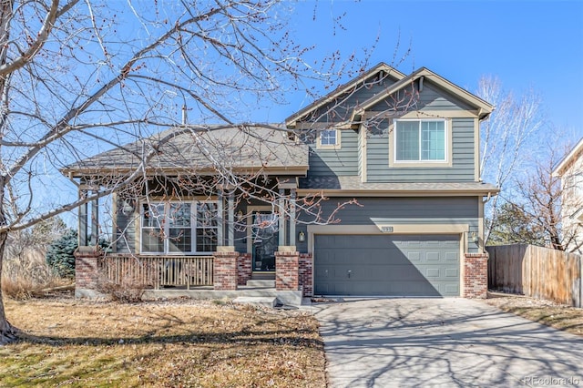 craftsman-style house with driveway, an attached garage, covered porch, fence, and brick siding