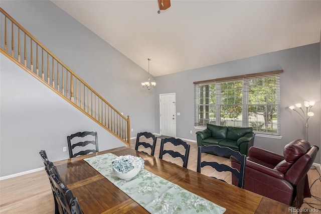 291 Las Lomas St, Brighton, CO 80601 - dining space featuring stairs, a chandelier, light wood finished floors, and high vaulted ceiling