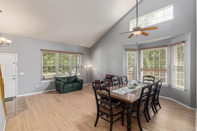 291 Las Lomas St, Brighton, CO 80601 - dining room with high vaulted ceiling, light wood-style floors, ceiling fan, and a chandelier