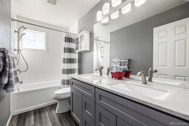 291 Las Lomas St, Brighton, CO 80601 - full bathroom with shower / bath combo, wood finished floors, and double vanity