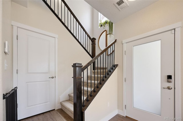 4177 E 98th Pl, Thornton, CO 80229 - foyer entrance featuring wood finished floors and stairs