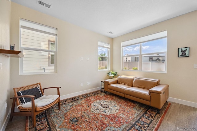 4177 E 98th Pl, Thornton, CO 80229 - living room featuring baseboards and wood finished floors
