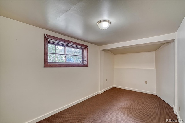 interior space with dark colored carpet