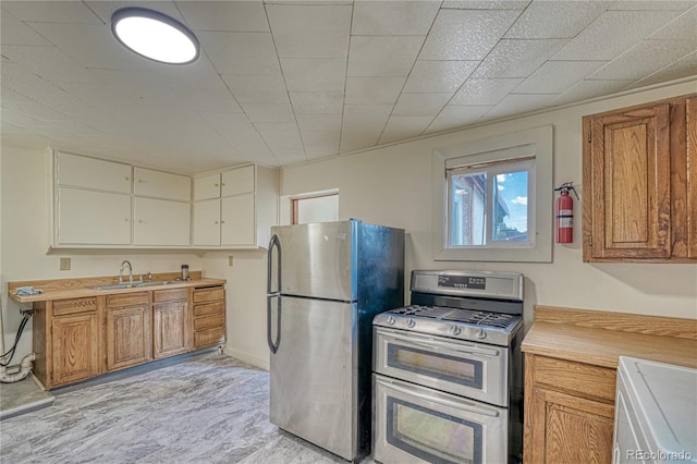 kitchen featuring stainless steel appliances and sink