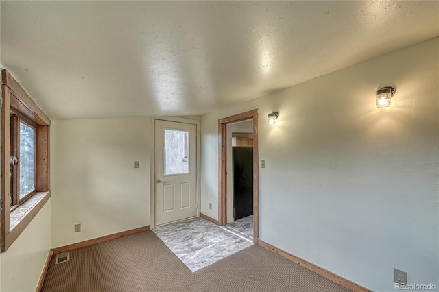 foyer with light carpet