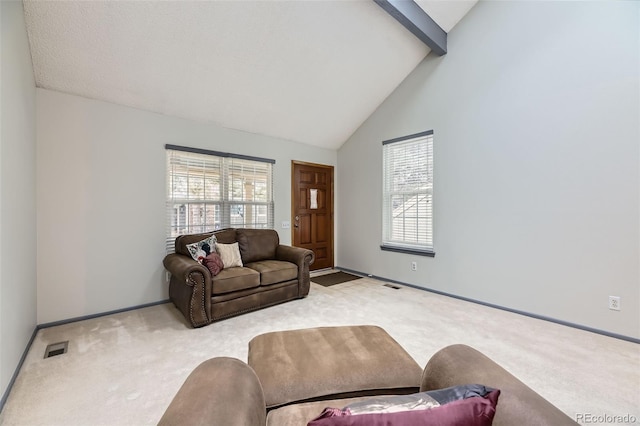 carpeted living area featuring high vaulted ceiling, baseboards, visible vents, and beam ceiling