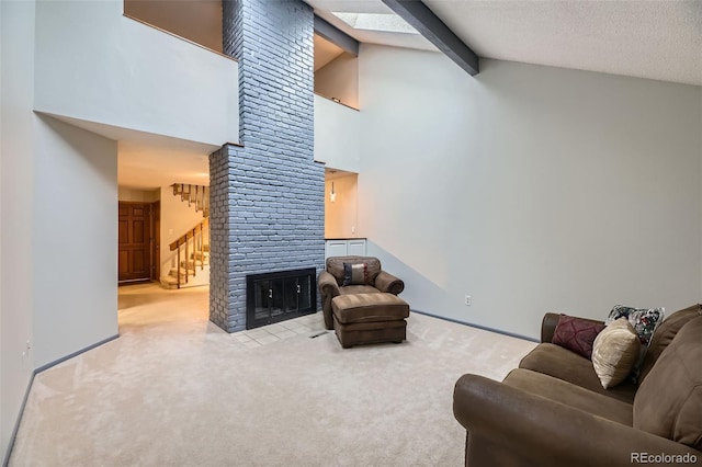 living area featuring carpet, beam ceiling, a fireplace, and stairway