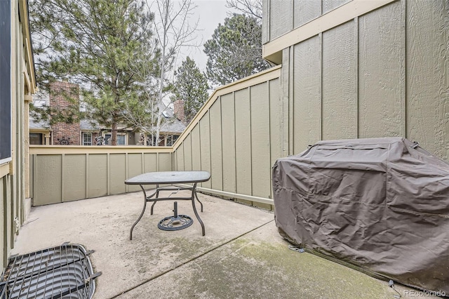 view of patio / terrace featuring fence