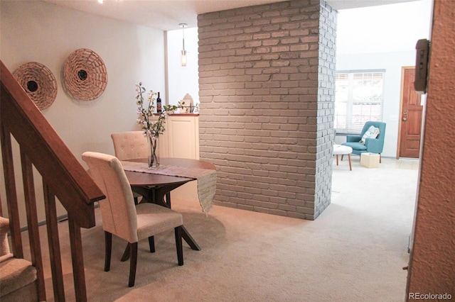 view of carpeted dining space
