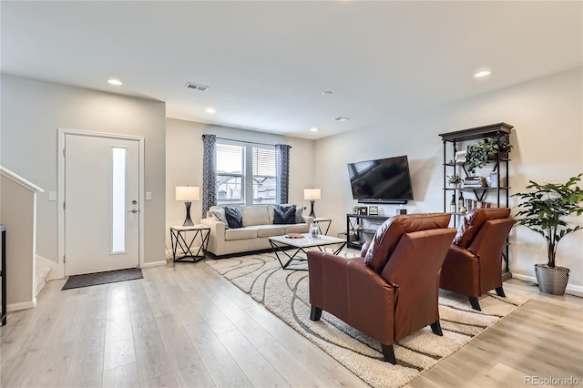 living room with light hardwood / wood-style floors