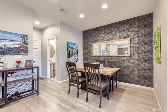 dining space featuring light hardwood / wood-style flooring