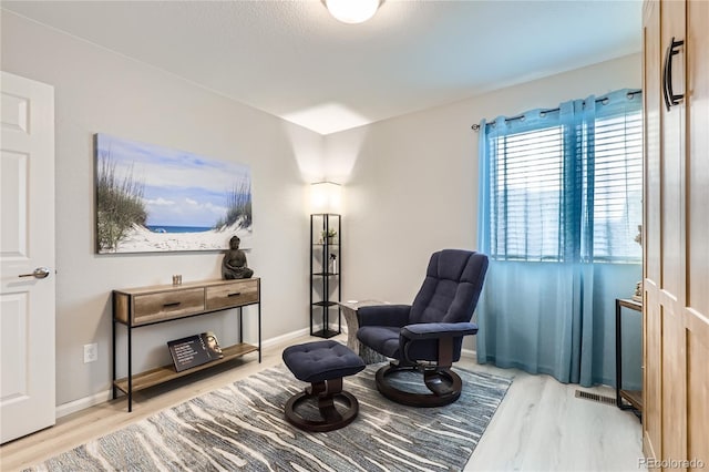 sitting room with light wood-type flooring