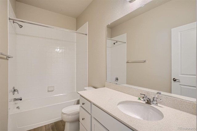 full bathroom with toilet, bathtub / shower combination, wood-type flooring, and vanity