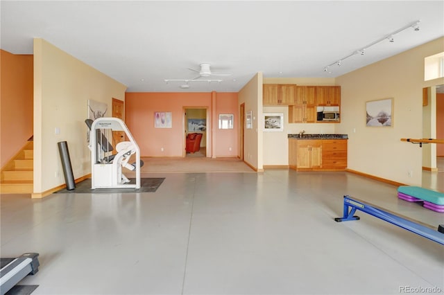 25803 Aspen Way, Golden, CO 80401 - exercise area with rail lighting, baseboards, and ceiling fan