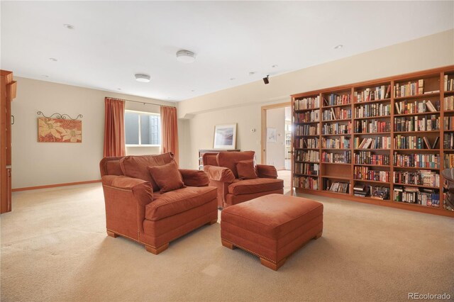 25803 Aspen Way, Golden, CO 80401 - carpeted living room with bookshelves and baseboards