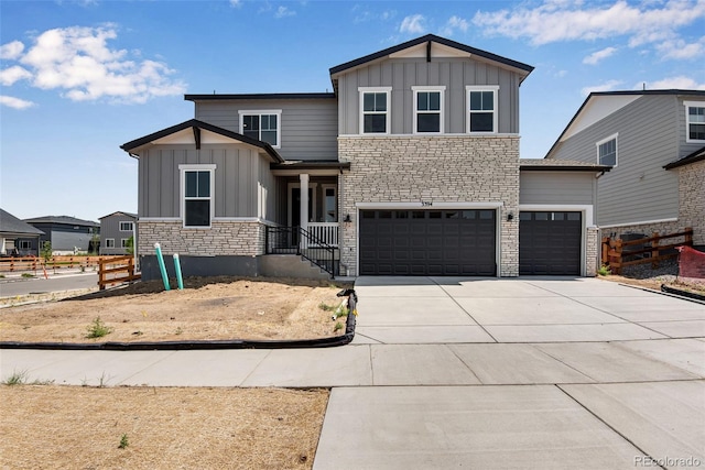 3394 N Grand Baker Ct, Aurora, CO 80019 - view of front facade with board and batten siding, stone siding, an attached garage, and concrete driveway
