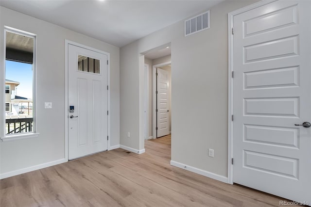 3394 N Grand Baker Ct, Aurora, CO 80019 - foyer entrance featuring baseboards and light wood finished floors