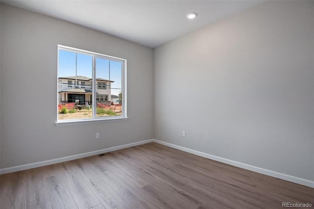 3394 N Grand Baker Ct, Aurora, CO 80019 - unfurnished room with wood finished floors and recessed lighting