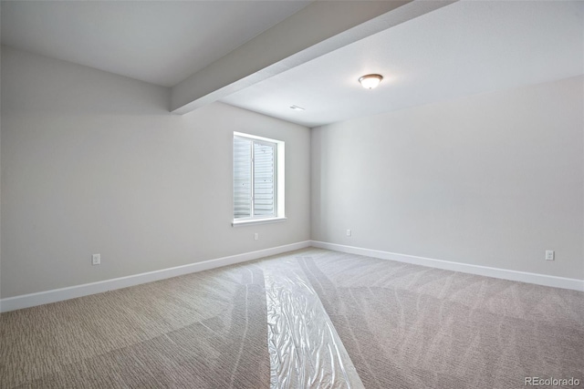 3394 N Grand Baker Ct, Aurora, CO 80019 - empty room featuring light colored carpet and beamed ceiling