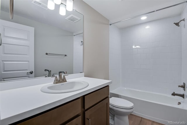 3394 N Grand Baker Ct, Aurora, CO 80019 - full bathroom with vanity, wood finished floors, shower / tub combination, and recessed lighting