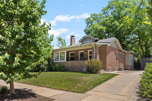 864 Garfield St, Denver, CO 80206 - view of front facade featuring brick siding and a chimney