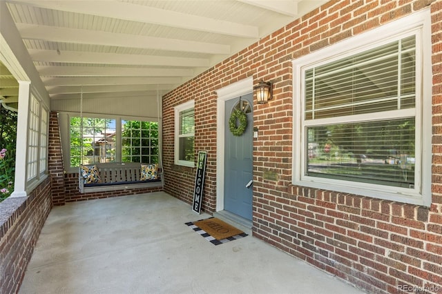 864 Garfield St, Denver, CO 80206 - entrance to property featuring covered porch and brick siding
