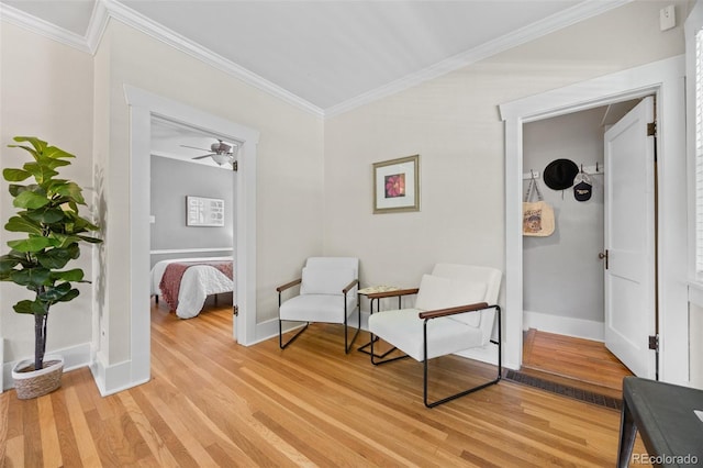 864 Garfield St, Denver, CO 80206 - sitting room featuring ornamental molding, light wood-style flooring, and a ceiling fan