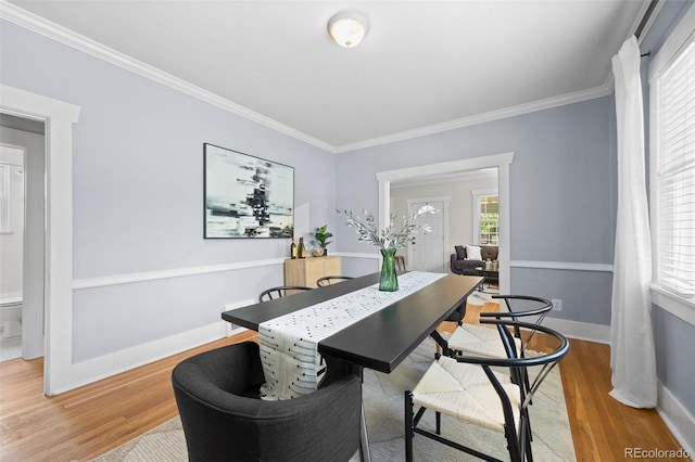 864 Garfield St, Denver, CO 80206 - dining area featuring ornamental molding and light wood finished floors