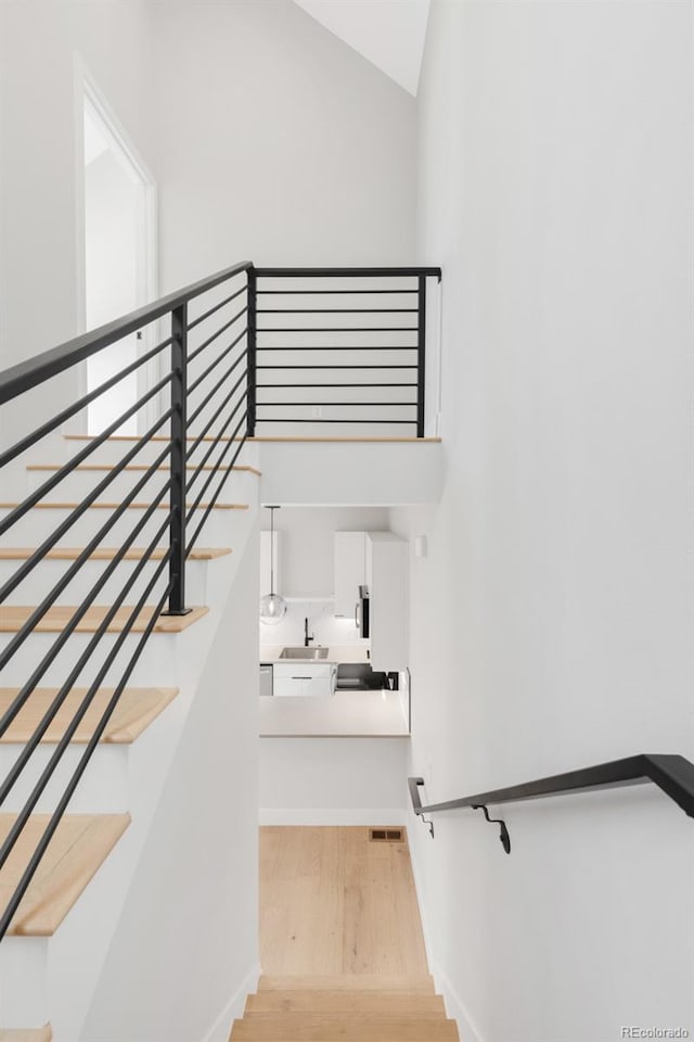 4232 Jason St Unit 2, Denver, CO 80211 - stairs with wood finished floors and lofted ceiling