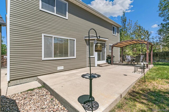 view of patio featuring a pergola and area for grilling