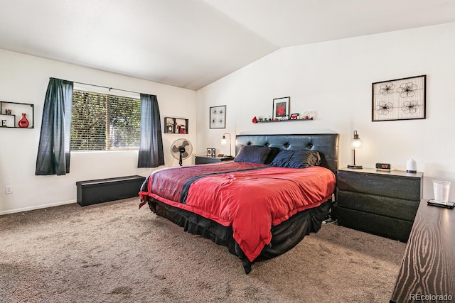 carpeted bedroom with lofted ceiling