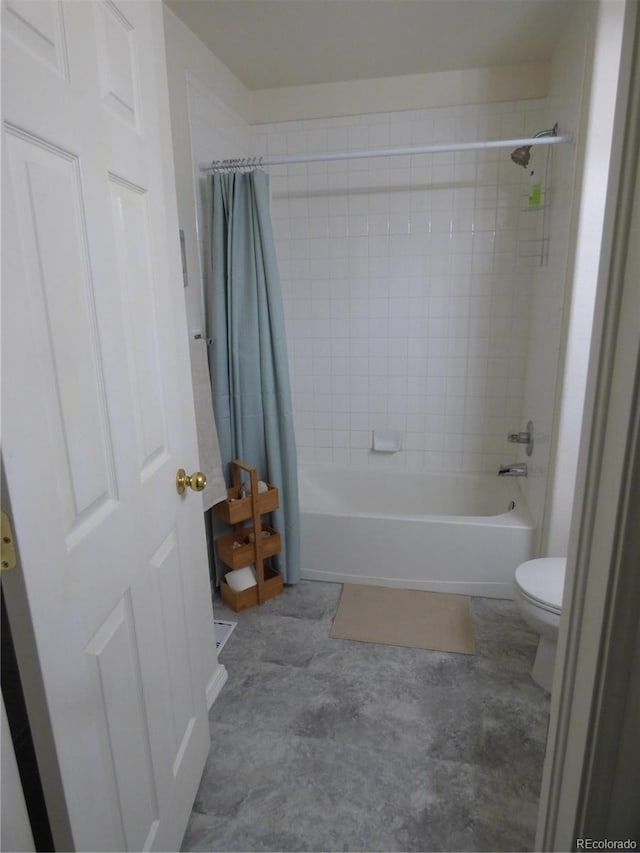 bathroom featuring toilet and shower / bathtub combination with curtain