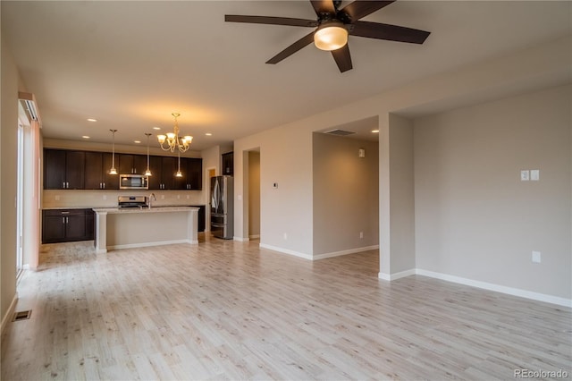 unfurnished living room featuring recessed lighting, light wood-style floors, and visible vents