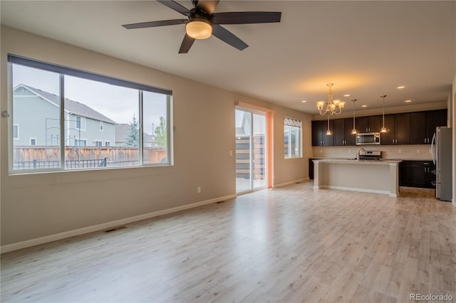 unfurnished living room featuring recessed lighting, baseboards, visible vents, and light wood-style floors