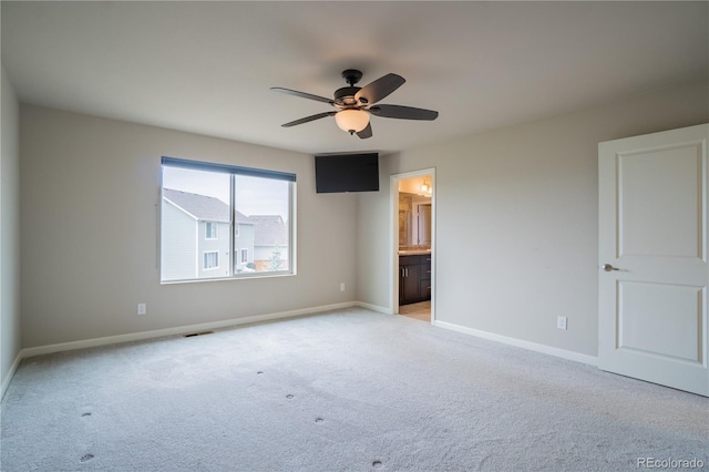 unfurnished bedroom with baseboards, visible vents, and light colored carpet