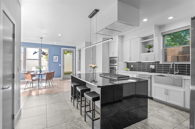 2745 Java Ct, Denver, CO 80211 - kitchen with stainless steel appliances, open shelves, white cabinetry, backsplash, and recessed lighting