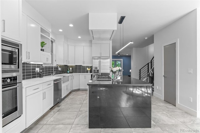 2745 Java Ct, Denver, CO 80211 - kitchen with built in appliances, open shelves, a kitchen island, white cabinets, and recessed lighting